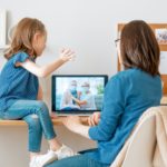 Woman and child talking with parents