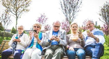 Senior people watching smartphones