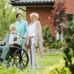Senior man on the wheelchair in the garden of professional nursing home